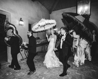 A breathtaking golden hour wedding portrait with the bride and groom under the veil. Captured in fine art wedding photography for a timeless, intimate moment.