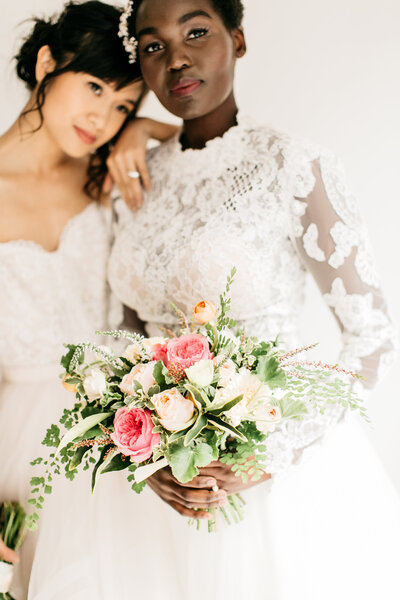Same Sex Brides Embracing Bridal Portrait  with Bridal Bouquet