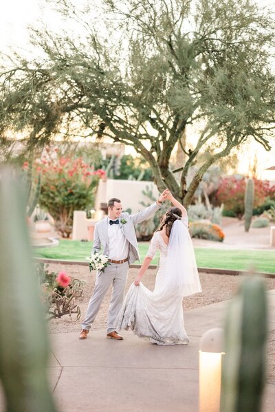 Wedding at JW Marriott Camelback Bride and Groom dancing with view of lawn