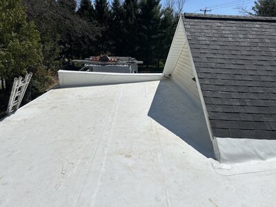 Newly installed rubber roofing, EPDM and TPO, on a residential low-sloped roof