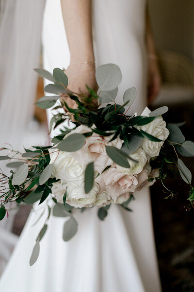 Bridal bouquet with cream roses and eucalyptus greenery