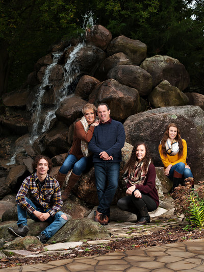 family pictures with a waterfall by lansing MI photography studio