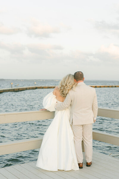 couple looking at lake conroe during their wedding at bentwater yacht club