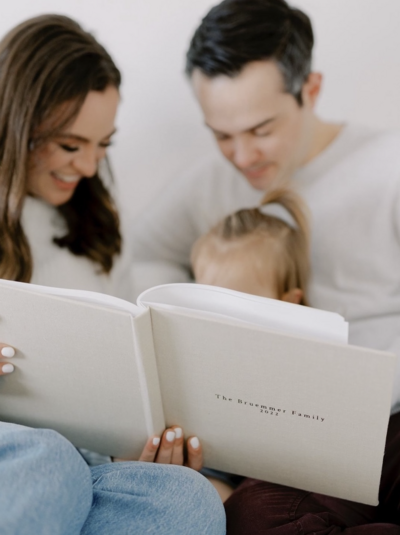 Family reading to their daughter during New Jersey family session