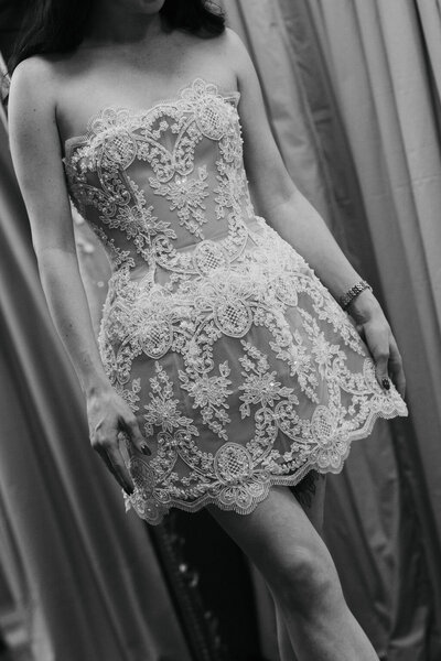 Bride with back turned in open back dress