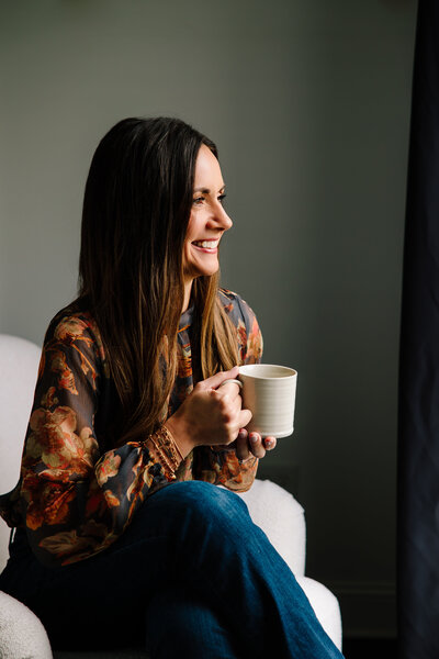 Christina holding a coffee mug