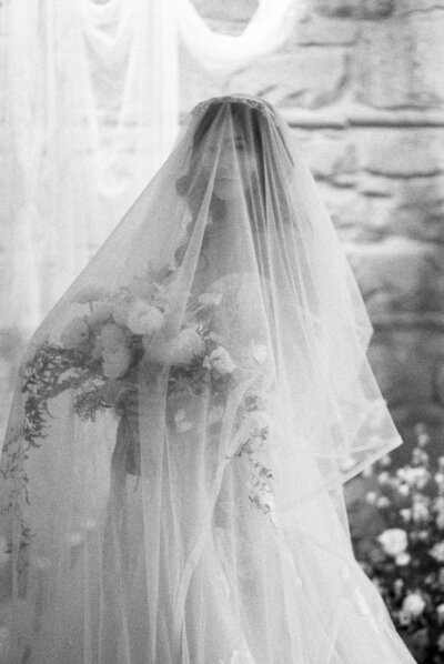 bride with bouquet and veil at the pioneer yyc