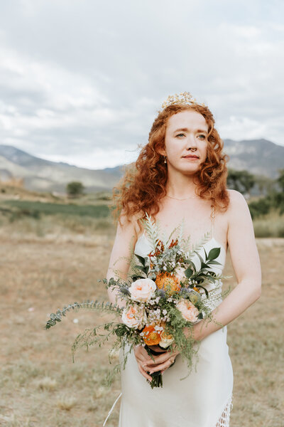 woman holding bouquet during wedding portraits