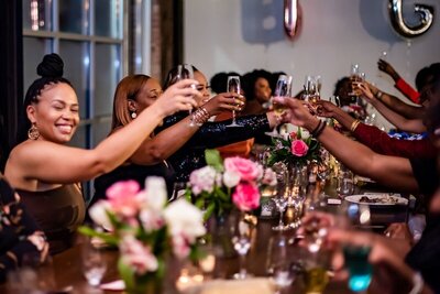 group of women toasting at social event