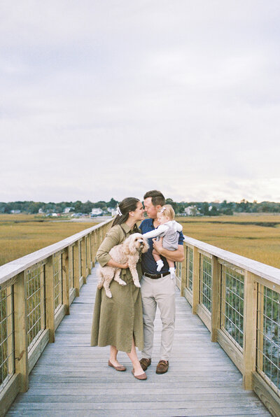 Boston wedding photographer with family on a dock 
