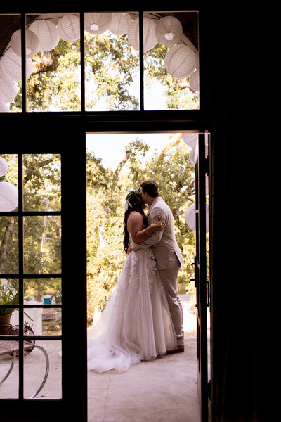 couple holding each other on path