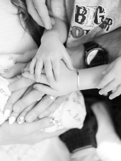 a family stacking their hands together