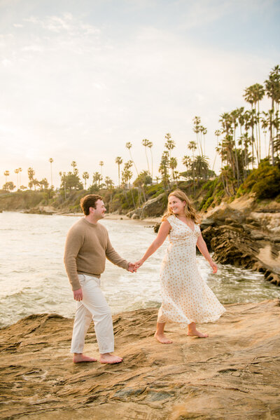 family holding hands walking on beach in la jolla california