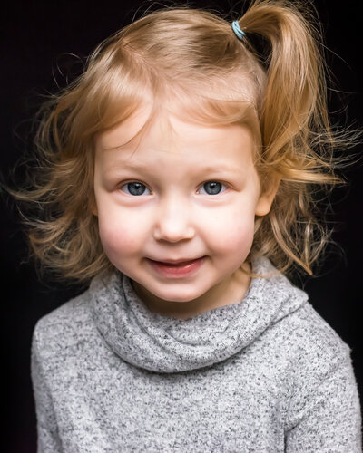 generic school portrait of  young girl with fake smile