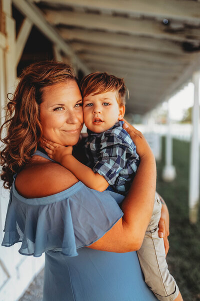Mother embraces her toddler during Family Photoshoot in Charleston, SC.