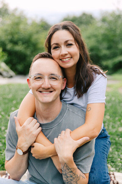 Asheville Couples Photographer captures couple on top of Jump Off Rock in Laurel Park, NC near Hendersonville, NC and Asheville, NC