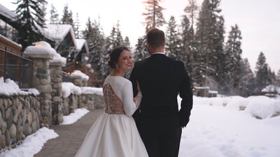 Husband and wife stand together outside for wedding