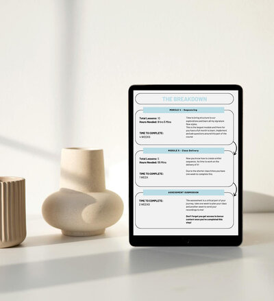 A tablet displays an overview of the Creative Sequencing course, highlighting the structured module breakdown and time commitments for prospective students, placed on a table alongside elegant ceramic decor for a calm learning environment.