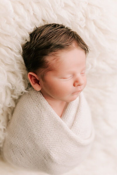 Mom and child snuggling for their portrait session