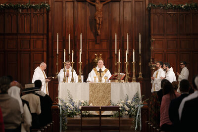 couple holding arms with a rosary