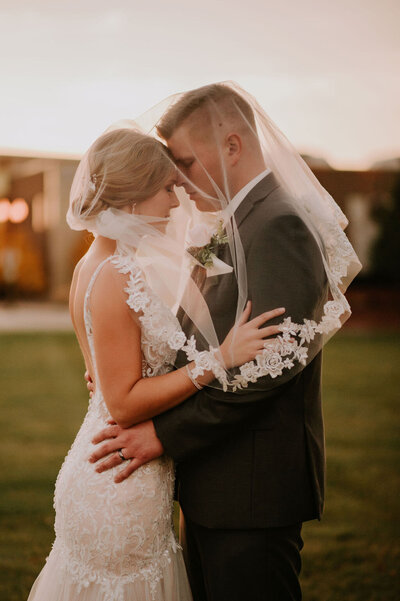 colorado wedding with bride and groom under brides veil