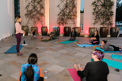 Photo of Rising Tide members at a meetup doing yoga