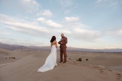 Couple holding hands overlooking Zabriskie Point
