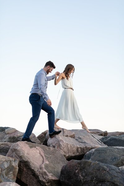 Mairead snuggles into her future husband as he rests his nose on her forehead during their engagement session in Windsor Ontario