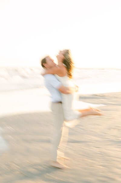couple on the beach with artistic blur