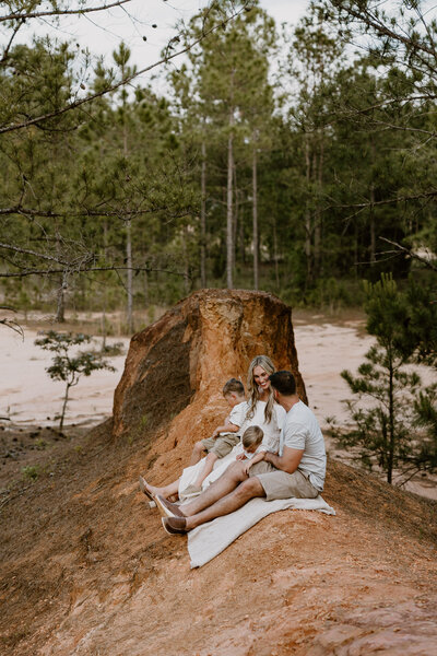 Family sitting on a blanket at