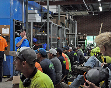 A group of Kansas City landscapers at a job meeting
