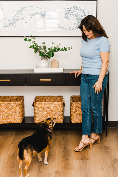 Dena looking at her dog