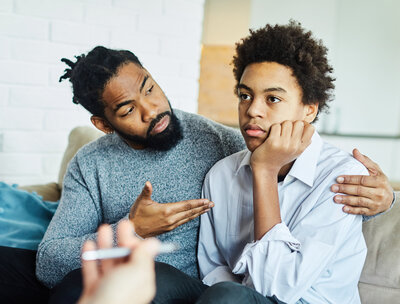 Young teen and father communicate with the provider at The Practice, which offers supportive teen counseling in Chandler, Tucson, Gilbert, and Tempe. 
