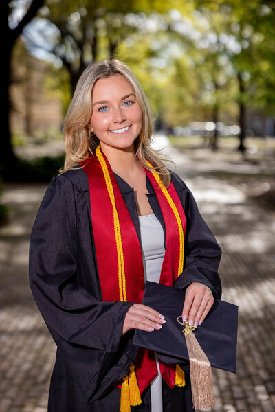 A University of South Carolina student taking his senior portraits on campus