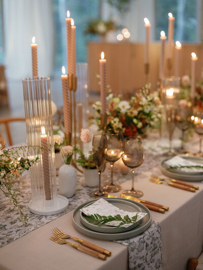 Romantic tablescape with candles and wine glasses