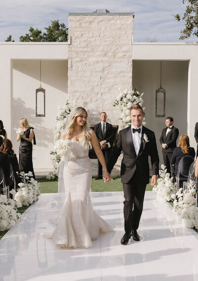 Bride and groom exiting ceremony at The Arlo wedding planned by Bianca Nichole and Co