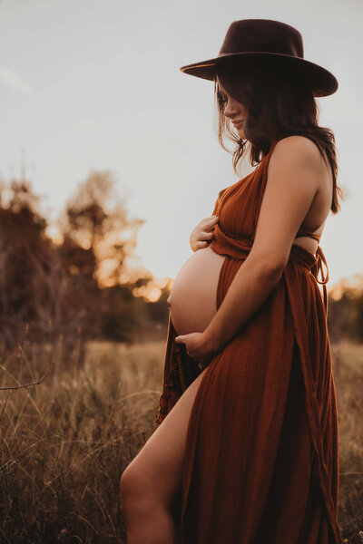 Golden Hour Maternity Photo Session in a Field in Houston Texas