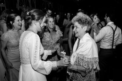 bride on the dance floor with family wedding day