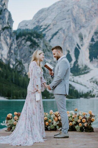 Couple exchanging vows on Lago Di Braies in the Dolomites
