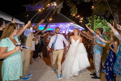 A sparkler exit with bride and groom at The Sandbar Restaurant