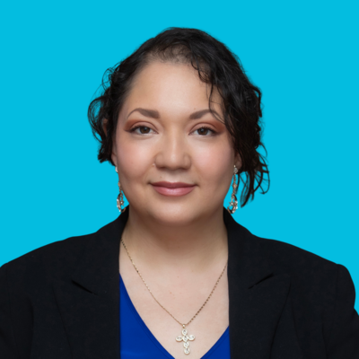 woman Family Housing Case manager at Move Forward with dark hair in blue and black shirt on blue background