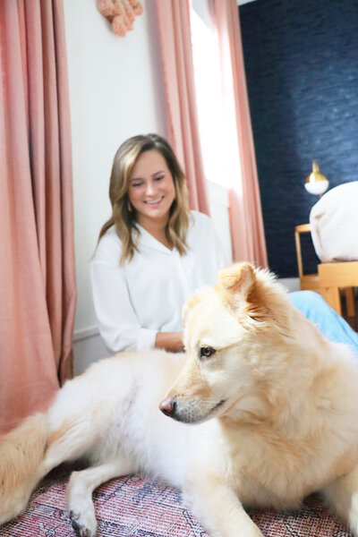 woman smiling at dog