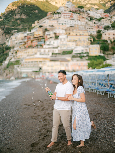 A quiet honeymoon moment on the beach in Positano, surrounded by sea, sunlight, and love