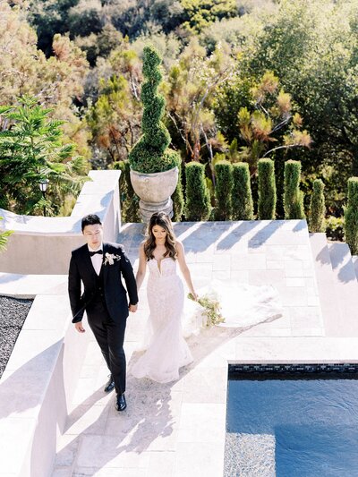 Bride and groom walk up memorial steps at their DC wedding