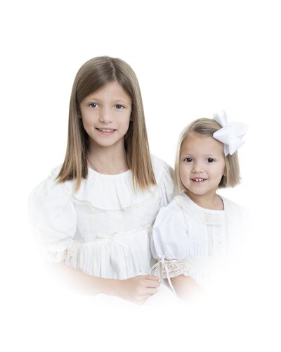heirloom photography of two young girls in matching vintage dresses