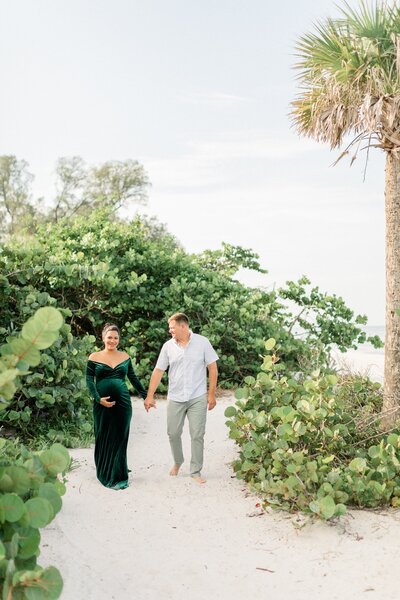 expecting couple at the beach from Naples maternity photographer