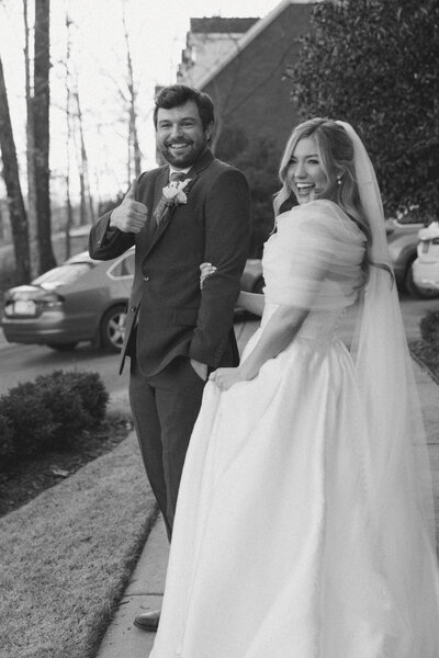 Documentary wedding photographer captures a couple descending the stairs at dreamy Birmingham summer wedding