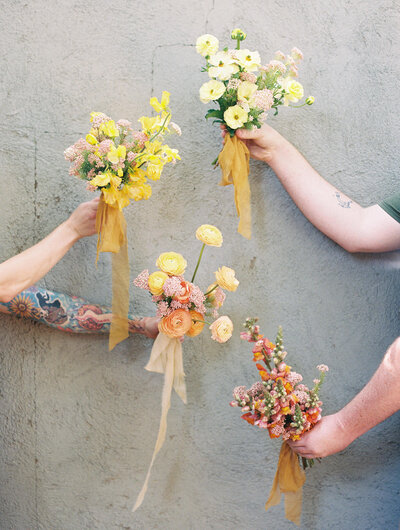 small bridesmaid posey bouquets each a different color made by moonlight floral co