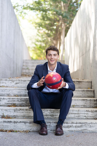 senior-guy-soccer-and-suit
