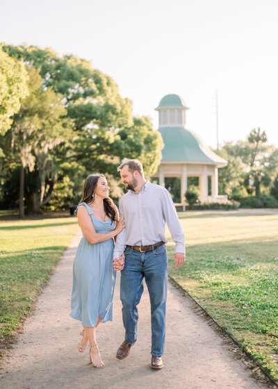 couple walking towards camera in charleston